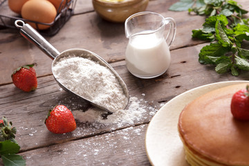ingredients of pancake on wooden table