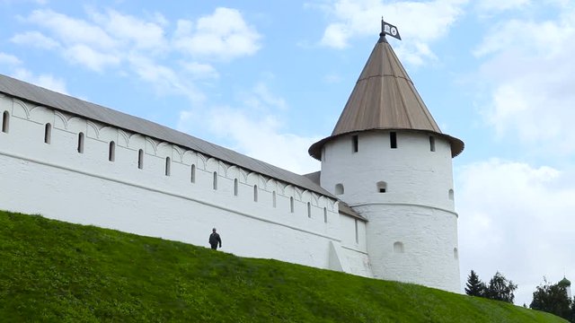 Man Comes Near South-West Tower and Kul Sharif Mosque of Kazan Kremlin. Kazan, Republic of Tatarstan, Russia. Attractions of Kazan