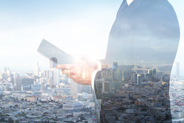 Man using tablet double exposure