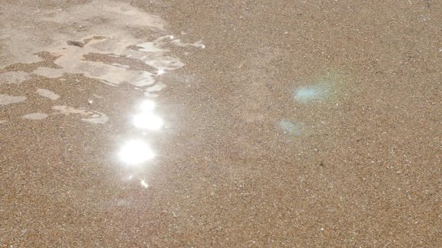 Transparent clear shallow water sparkling sea beach and sand 4K 2160p 30fps UltraHD video - Summer vacation fine ocean beach golden sand 4K 3840X2160 UHD footage
