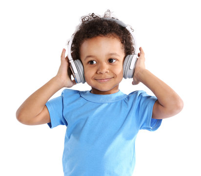 Little Boy In Blue Shirt Wearing Headphones Isolated On White Background