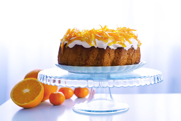 Delicious citrus cake on table