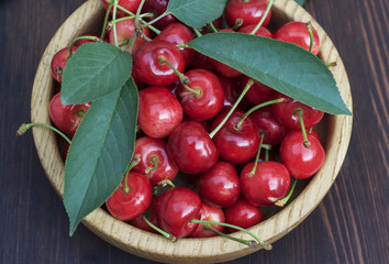 Cherry in wooden plate