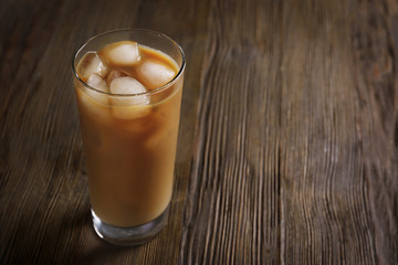 Cold coffee on wooden table