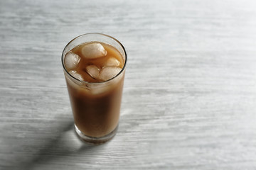 Cold coffee on wooden table