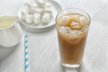 Cold coffee on wooden table