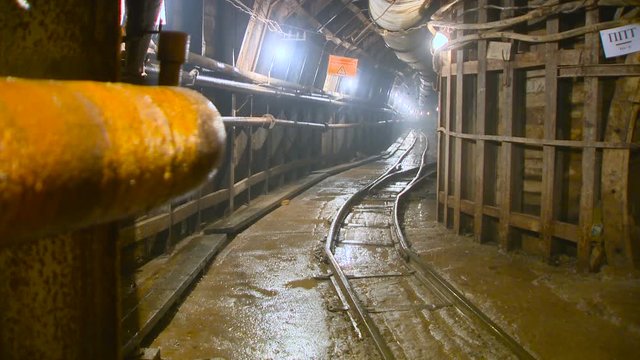 Railway Tunnel, Rusty Pipe, Dripping From the Ceiling. It's Wet. Underground Construction of Subway Tunnel