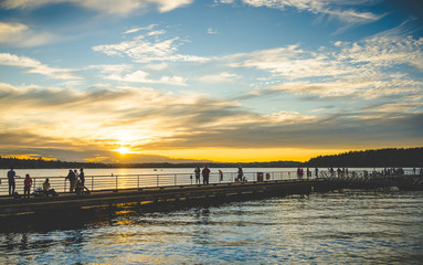 scene of walk way on the lake when sunset.