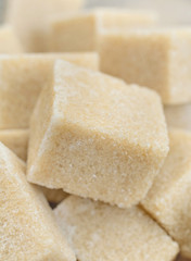 Sugar brown cubes on background