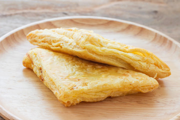 Chicken pie on a wooden plate