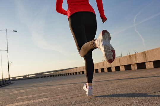 Close up shot of running woman. Selective focus
