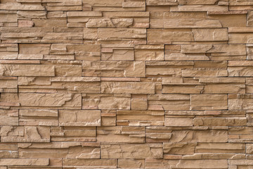 Close up brown stone wall texture background.