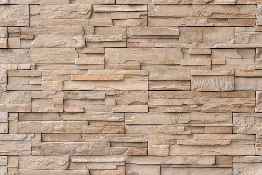 Close up light brown stone wall texture background