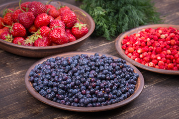 Fresh strawberries and blueberries , wild berry.
