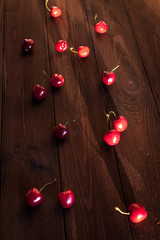 sweet cherry in the jar on wooden background