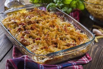 Casserole fusilli pasta with sausage, zucchini and cheese