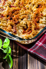 Casserole fusilli pasta with sausage, zucchini and cheese