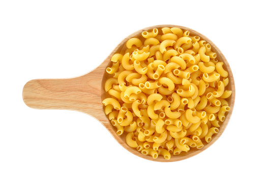 Gomiti elbows pasta in wooden plate on white background