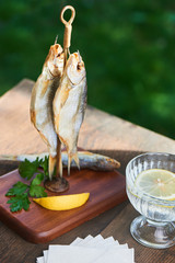 Felted Astrakhan roach served on a wooden stand with hook