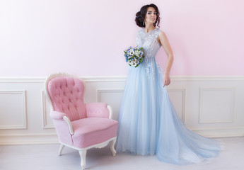 Fototapeta premium Beautiful bride with a bouquet before the wedding ceremony in ro