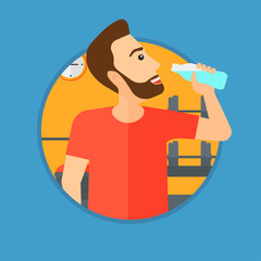 Sportive man drinking water.
