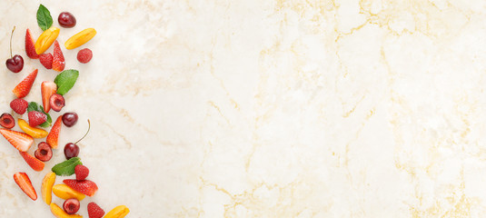 background of fruits and berries on a marble table