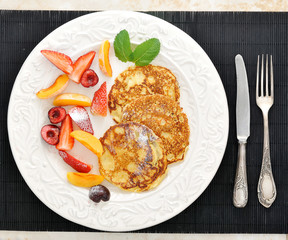 dessert - pancakes with strawberries, peach, and black cherry wi