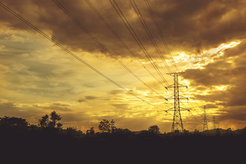 Electric power line with colorful sky at sunset - Vibrant color