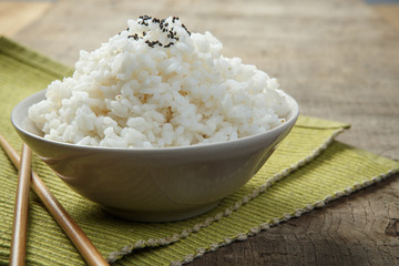 A bowl of rice on a fabric mat