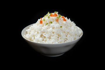 Bowl of organic white rice isolated on a black background