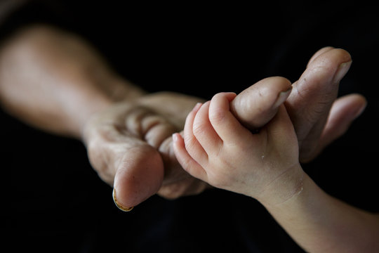 Friendship and Binding, Be hand in hand, Close up baby hands hol