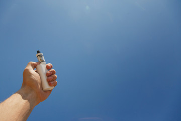 Adjustable electronic cigarette, Non carcinogenic alternative for smoking, sunset in the...