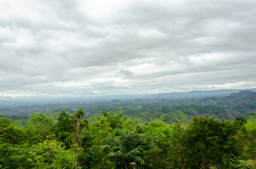 Obraz premium Top view of naturel mountains landscape with black rain clouds in the rainy season