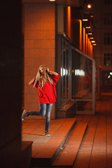 Young woman with dreadlocks dance outdoors. Film or polaroid style colors