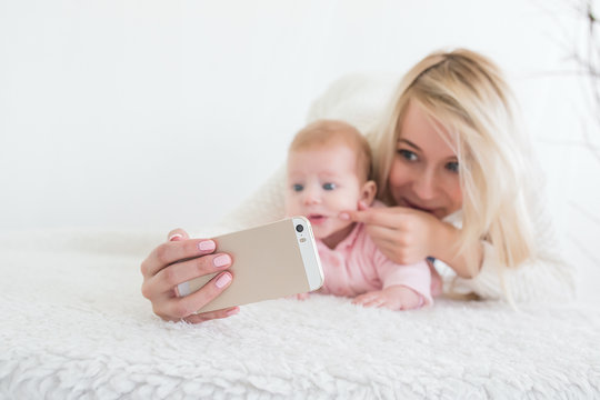baby make selfie on mobile phone
