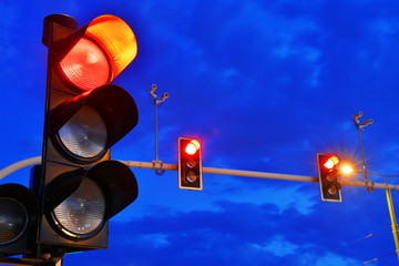 Traffic lights over sky after sunset