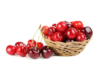 Ripe cherries in basket isolated on a white background