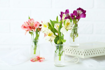 Beautiful alstroemeria flowers on a white wooden table