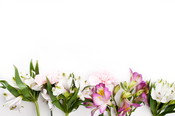 Fototapeta na wymiar Pink gillyflowers with alstroemeria on white background