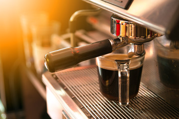 espresso machine making coffee at coffee shop. close up, fresh coffee.