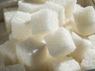 Fototapeta na wymiar Close up shot of white refinery sugar.