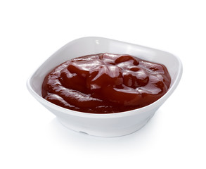 Bowl of tomato sauce sauce on white background
