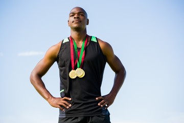 Fototapeta premium Athlete with gold medals around his neck