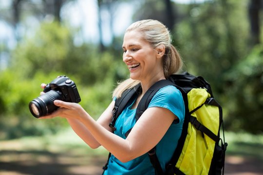 Woman smiling and looking her camera 