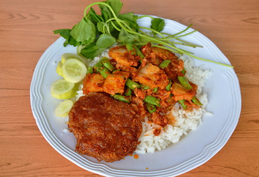 deep fried minced pork and spicy crispy pork curry on rice