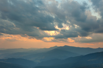 Sundown Sky and Mountains Range Background