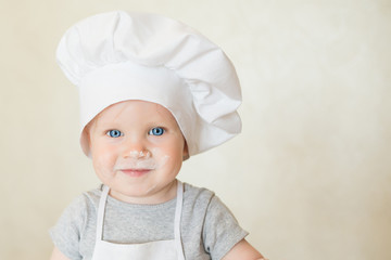 The little boy in a suit of the cook