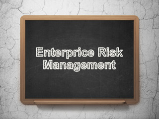 Finance concept: Enterprice Risk Management on chalkboard background