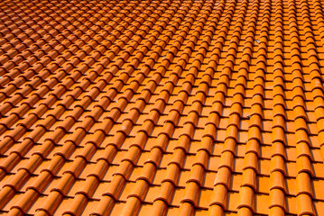 Orange glazed terracotta roof tiles