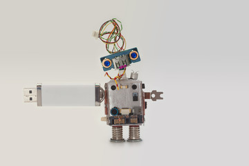 Robot with usb flash storage stick. Data storing concept, abstract computer character blue eyed head, electrical wire hairstyle. Copy space, gradient white gray background